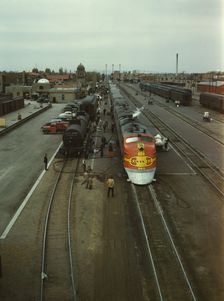 Santa Fe R.R. streamliner, the "Super Chief," being serviced..., Albuquerque, N.Mexico, 1943. Creator: Jack Delano