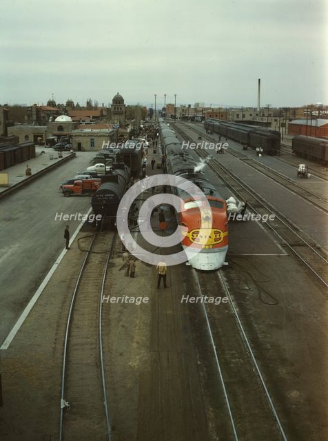 Santa Fe R.R. streamliner, the "Super Chief," being serviced..., Albuquerque, N.Mexico, 1943. Creator: Jack Delano.