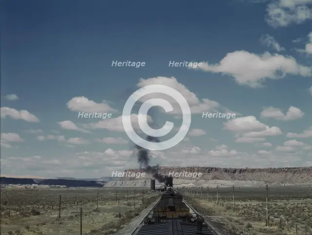 Santa Fe R.R. train stopping for coal and water, Laguna, New Mexico, 1943. Creator: Jack Delano.