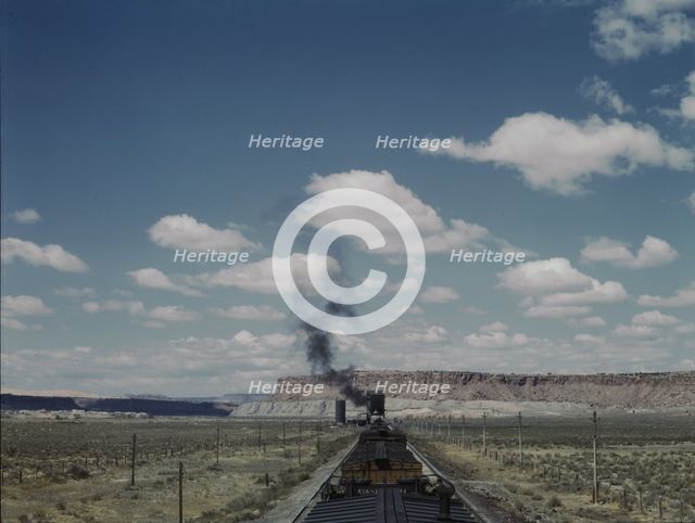 Santa Fe R.R. train stopping for coal and water, Laguna, New Mexico, 1943. Creator: Jack Delano.