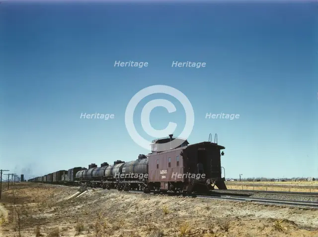 Santa Fe R.R. west bound freight stopping for water, Melrose, New Mexico, 1943. Creator: Jack Delano.