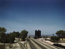 Santa Fe R.R. going through Yucca, Arizona; a watering and refueling stop, 1943. Creator: Jack Delano