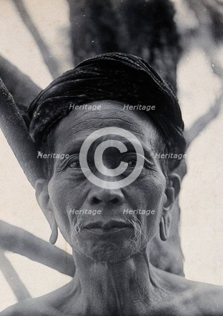 Sarawak: Tama Kulieng, a chief of the Butang Kayan River tribe, c1900.. Creator: Unknown.