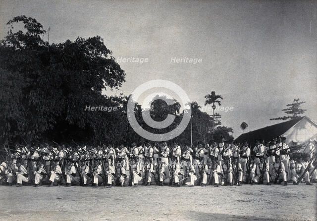 Sarawak: a line-up of armed Sarawak Rangers, c1900. Creator: Unknown.