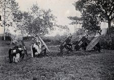Sarawak: five Kenyah warriors in a warfare ritual, c1900. Creator: Unknown