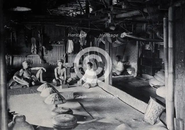 Sarawak: interior of a Kadayan tribal house, with a meal laid out, c1900. Creator: Unknown.