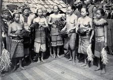 Sarawak: Sea Dayak men at a head feast, c1900. Creator: Unknown