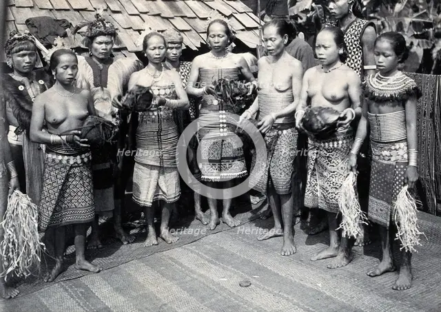 Sarawak: Sea Dayak men at a head feast, c1900. Creator: Unknown.