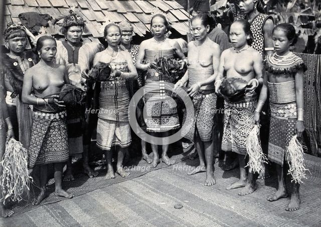 Sarawak: Sea Dayak men at a head feast, c1900. Creator: Unknown.