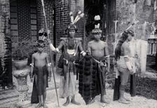 Sarawak: Sea Dayaks with weapons and head-dresses, c1900. Creator: Unknown