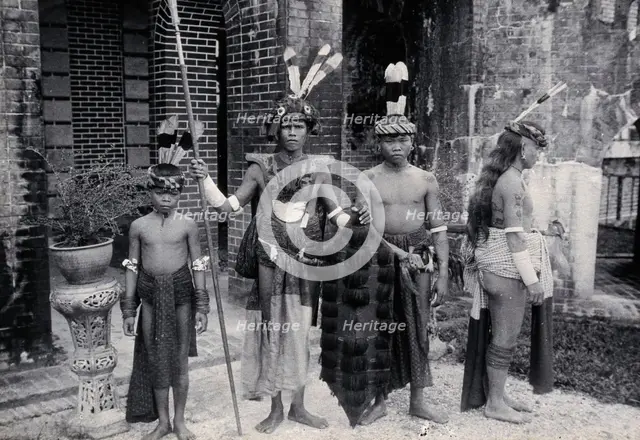 Sarawak: Sea Dayaks with weapons and head-dresses, c1900. Creator: Unknown.