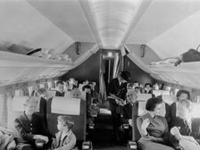 SAS stewardess serving on a flight, 1960. Creator: Torkel Lindeberg