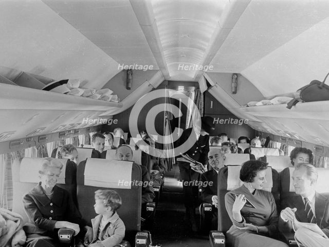 SAS stewardess serving on a flight, 1960. Creator: Torkel Lindeberg.