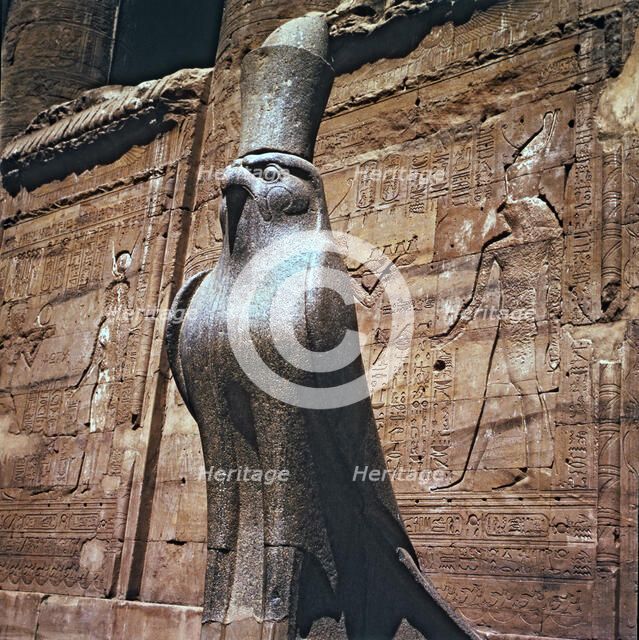 Sculpture of the god Horus at the Edfu temple entrance in Egypt.
