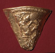 Scythian gold plate showing a winged panther attacking a goat