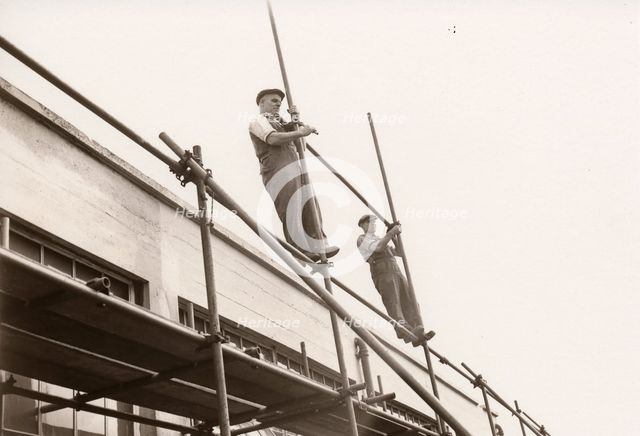 Scaffolders erecting scaffolding, 1951. Artist: Unknown