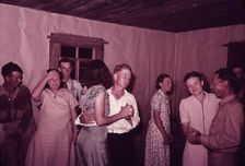 Scene at square dance in rural home in McIntosh County, Oklahoma, 1939 or 1940. Creator: Russell Lee
