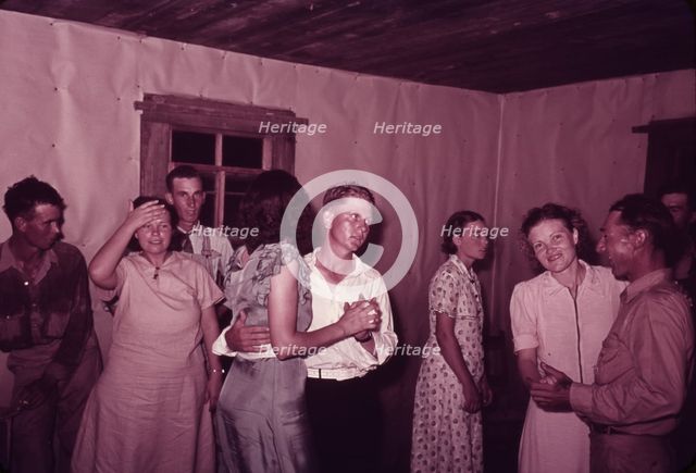 Scene at square dance in rural home in McIntosh County, Oklahoma, 1939 or 1940. Creator: Russell Lee.