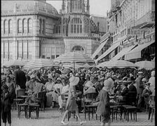 Scene from the Film The Compulsory Husband': Crowds of Holiday Makers Sitting at Out..., 1920s. Creator: British Pathe Ltd