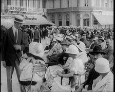 Scene from the Film The Compulsory Husband': Crowds of Holiday Makers Sitting at Out..., 1920s. Creator: British Pathe Ltd