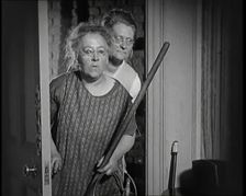Scene from the Film The Compulsory Husband': Two Actors Portraying Cleaners Carrying..., 1920s. Creator: British Pathe Ltd