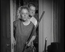 Scene from the Film The Compulsory Husband': Two Actors Portraying Cleaners Carrying..., 1920s. Creator: British Pathe Ltd
