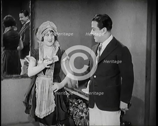 Scene from the Film 'The Compulsory Husband': The Actor Monty Banks Arriving at the House..., 1920s. Creator: British Pathe Ltd.