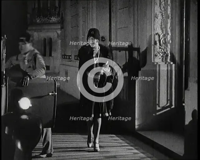 Scene from the Film 'The Compulsory Husband':  The Actor Monty Banks Opening the Car..., 1920s. Creator: British Pathe Ltd.