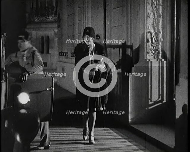 Scene from the Film 'The Compulsory Husband':  The Actor Monty Banks Opening the Car..., 1920s. Creator: British Pathe Ltd.