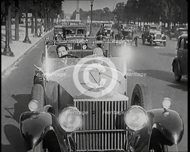 Scene from the Film 'The Compulsory Husband': The Actor Monty Banks Driving a Car With..., 1920s. Creator: British Pathe Ltd.