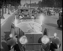 Scene from the Film The Compulsory Husband': The Actor Monty Banks Driving a Car With..., 1920s. Creator: British Pathe Ltd