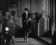 Scene from the Film The Compulsory Husband': The Actor Monty Banks Opening the Car..., 1920s. Creator: British Pathe Ltd