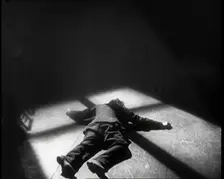Scene from the Film The Informer': Lars Hansen Falling Down Dead in a Church After..., 1920s. Creator: British Pathe Ltd