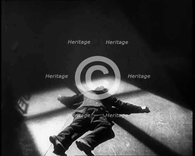Scene from the Film 'The Informer':  Lars Hansen Falling Down Dead in a Church After..., 1920s. Creator: British Pathe Ltd.