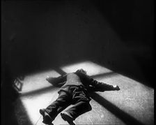 Scene from the Film The Informer': Lars Hansen Falling Down Dead in a Church After..., 1920s. Creator: British Pathe Ltd