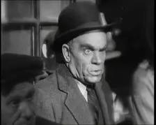 Scene from the Film The Informer': Male Actor Looking at Money Being Thrown on the..., 1920s. Creator: British Pathe Ltd