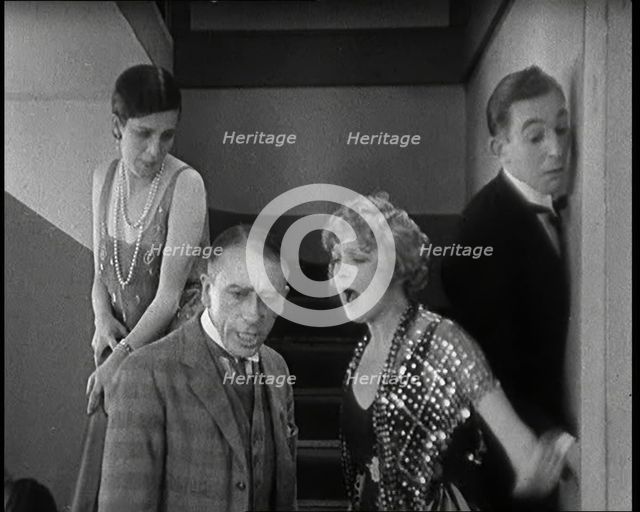 Scene from the Film 'Champagne': Betty Balfour Arguing With Her Companions, 1920s. Creator: British Pathe Ltd.