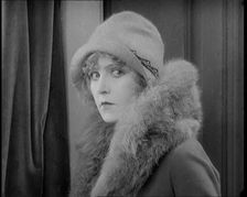 Scene from the Film Champagne': Betty Balfour Entering a Bedroom With a Male..., 1920s. Creator: British Pathe Ltd