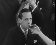 Scene from the Film Champagne': Betty Balfour in a Nightclub Drinking Champagne and Giving...,1920s Creator: British Pathe Ltd