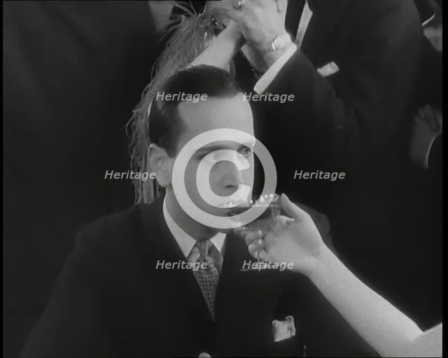 Scene from the Film 'Champagne': Betty Balfour in a Nightclub Drinking Champagne and Giving...,1920s Creator: British Pathe Ltd.