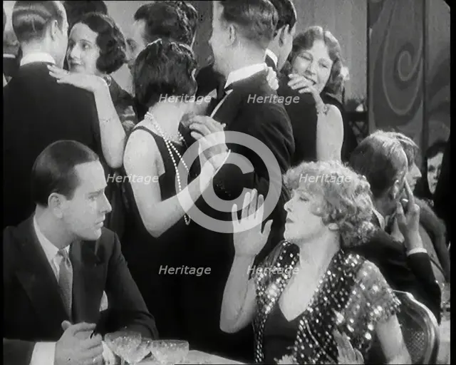 Scene from the Film 'Champagne': Betty Balfour in a Nightclub Drinking Champagne and..., 1920s. Creator: British Pathe Ltd.