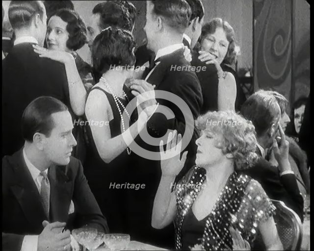 Scene from the Film 'Champagne': Betty Balfour in a Nightclub Drinking Champagne and..., 1920s. Creator: British Pathe Ltd.