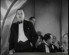 Scene from the Film Champagne': Male Actor Standing on a Balcony Overlooking the Nightclub...,1920s Creator: British Pathe Ltd