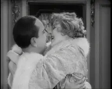 Scene from the Film Champagne': The Actress Betty Balfour Embracing the Male Actor Jean..., 1920s. Creator: British Pathe Ltd