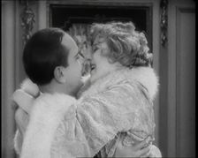Scene from the Film Champagne': The Actress Betty Balfour Embracing the Male Actor Jean..., 1920s. Creator: British Pathe Ltd