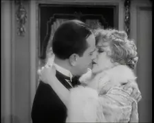 Scene from the Film Champagne': The Actress Betty Balfour Embracing the Male Actor Jean..., 1920s. Creator: British Pathe Ltd