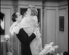 Scene from the Film Champagne': The Actress Betty Balfour Embracing the Male Actor Jean..., 1920s. Creator: British Pathe Ltd