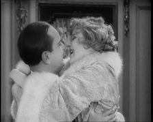 Scene from the Film Champagne': The Actress Betty Balfour Embracing the Male Actor Jean..., 1920s. Creator: British Pathe Ltd