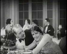 Scene from the Film Champagne': Two Actors Sitting at a Table in a Nightclub, 1920s. Creator: British Pathe Ltd