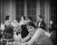 Scene from the Film Champagne': Two Actors Sitting at a Table in a Nightclub, 1920s. Creator: British Pathe Ltd